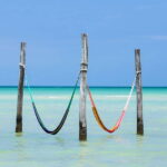 One of the best things to do in Holbox, is to just relax on the hammocks while being in the ocean and enjoying its magnificent beach view, get ready for a Full Day Holbox Excursion!