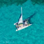 Spend an amazing time at the half day private catamaran tour to Isla Mujeres and get the chance to sail through the crystal-clear waters