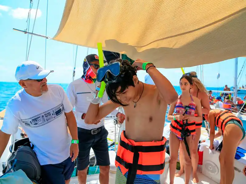 Get onboard on a half day private catamaran with a shaded area on our sailing tour to Isla Mujeres