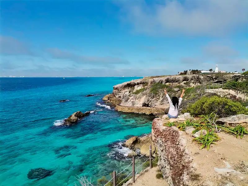 Go on a golf cart and visit south beach to enjoy this beautiful scenery on our private catamaran sailing tour to Isla Mujeres