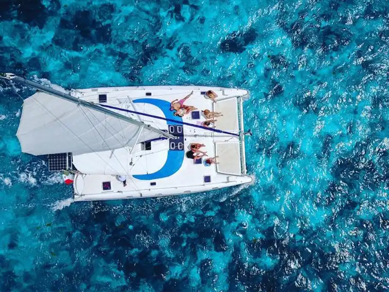 Have a relaxing time under the sun while experiencing this beautiful turquoise blue sea sailing on our Full Day Sail Cat 30 Guests to Isla Mujeres Tour