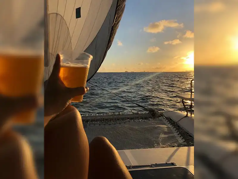 On your way back from Isla Mujeres, enjoy the stunning sunset while having a tequila party onboard of the Sail Cat 30 Guests Full Day tour