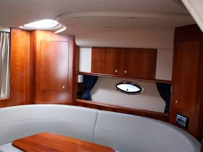 Private Yacht for Twelve Passengers in Cancun offers a comfortable Cabin with places to sit and a table