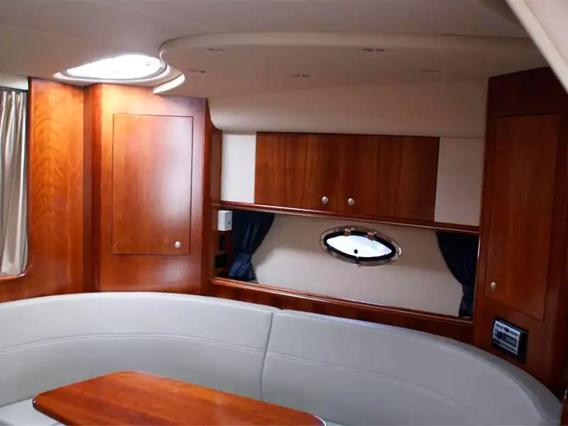 Private Yacht for Twelve Passengers in Cancun offers a comfortable Cabin with places to sit and a table
