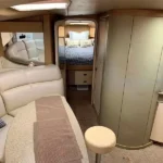 Yacht in Cancun 15 Passengers with 2 bedrooms, a living room with a comfy sofa and a small kitchen