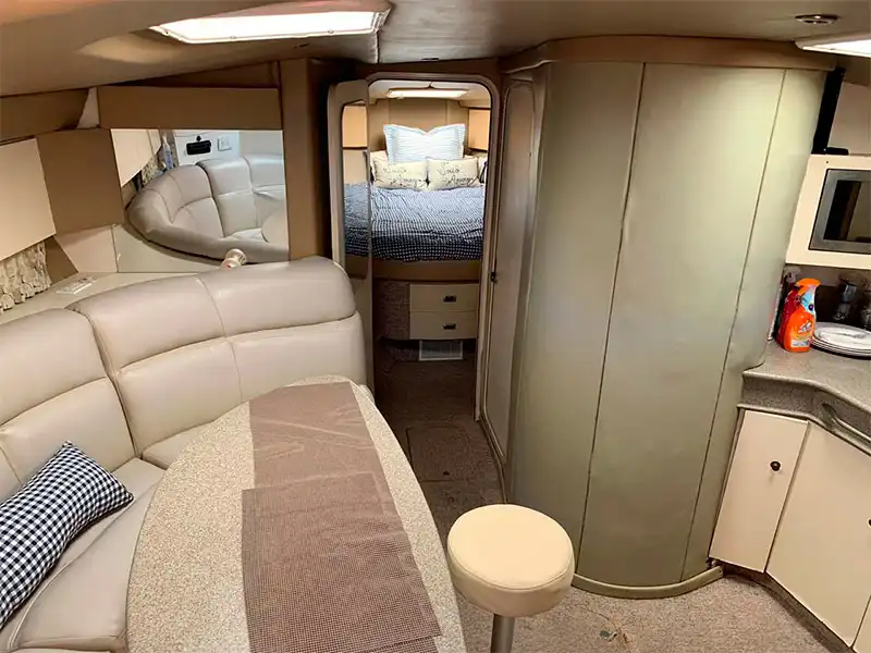 Yacht in Cancun 15 Passengers with 2 bedrooms, a living room with a comfy sofa and a small kitchen